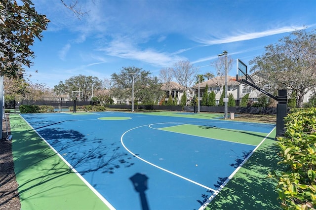 view of sport court featuring community basketball court and fence