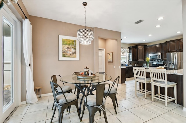 dining space with light tile patterned flooring, visible vents, recessed lighting, and baseboards