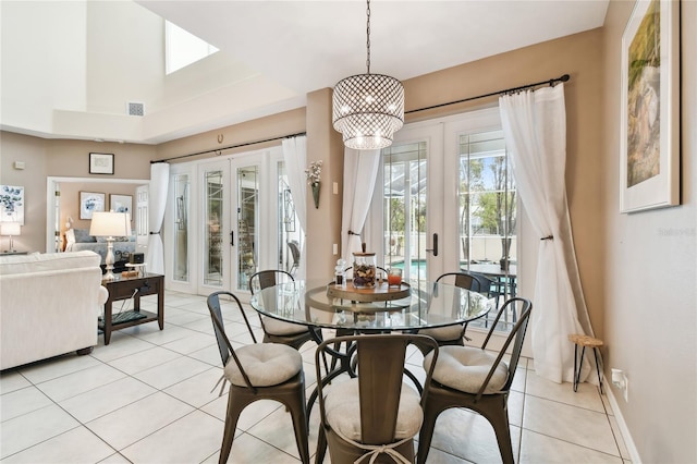 dining room with light tile patterned floors, visible vents, french doors, and an inviting chandelier