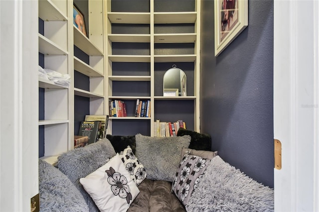 sitting room featuring a textured wall