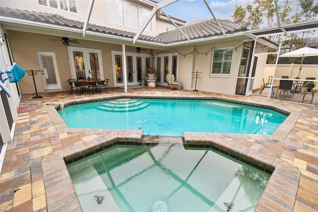 view of swimming pool with outdoor dining space, french doors, glass enclosure, ceiling fan, and a patio area