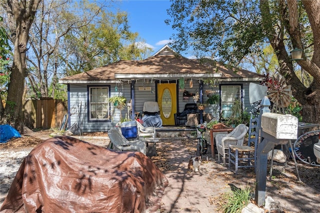 view of front of house with fence