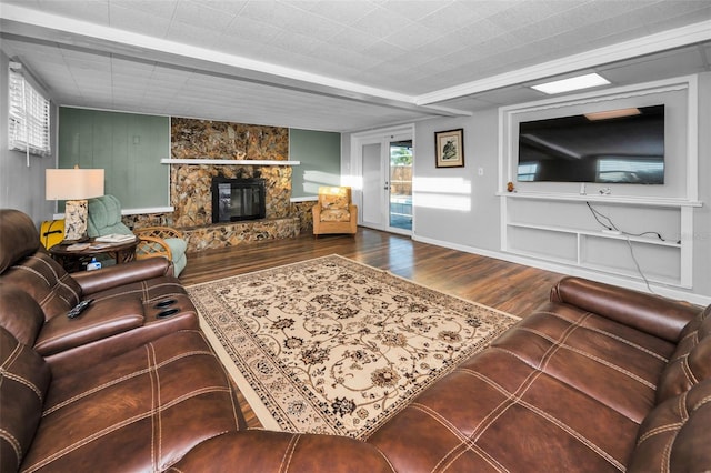 living area featuring a fireplace and wood finished floors