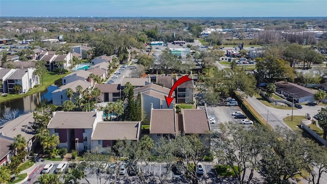 bird's eye view with a water view and a residential view