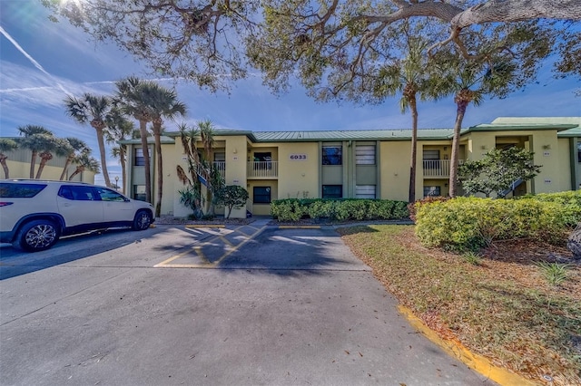 view of property with uncovered parking