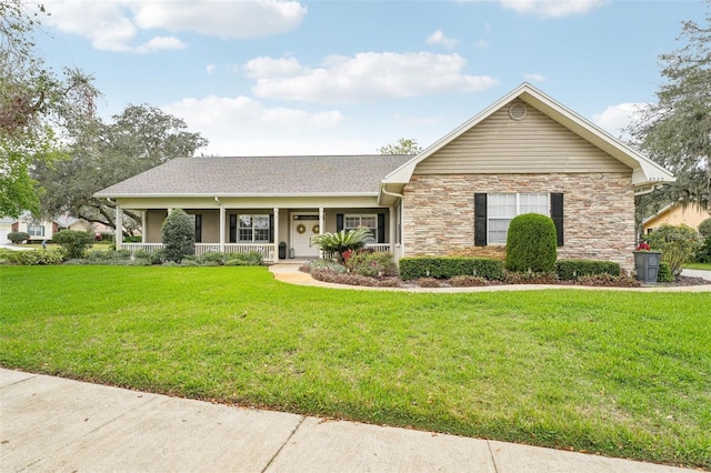 ranch-style home with a porch, stone siding, and a front lawn