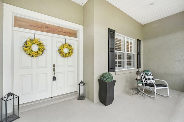 property entrance featuring covered porch