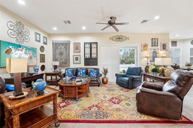 living room featuring visible vents, carpet flooring, a ceiling fan, and recessed lighting