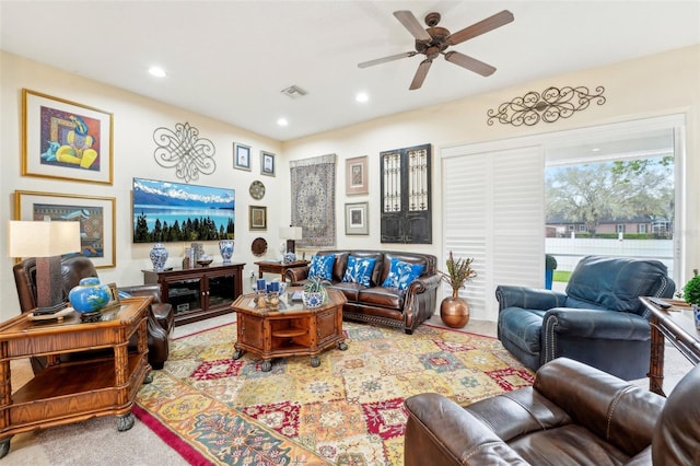 living area featuring ceiling fan, visible vents, and recessed lighting