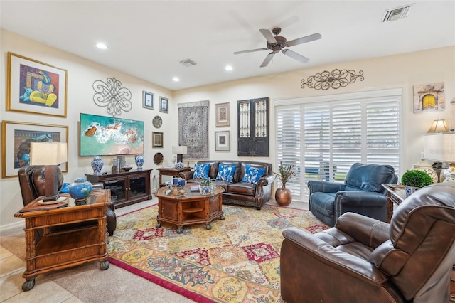 living room with a ceiling fan, recessed lighting, visible vents, and light tile patterned floors