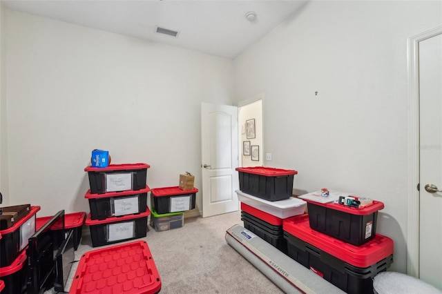 recreation room featuring light carpet and visible vents