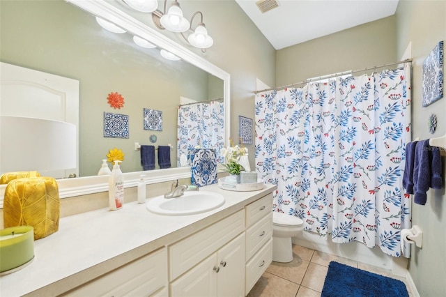 bathroom with tile patterned flooring, visible vents, vanity, and toilet