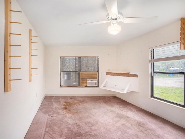 unfurnished living room featuring lofted ceiling, carpet floors, and a ceiling fan