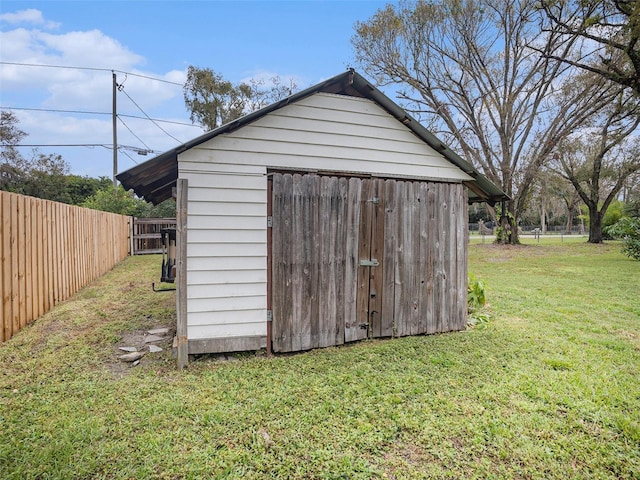 view of shed featuring a fenced backyard