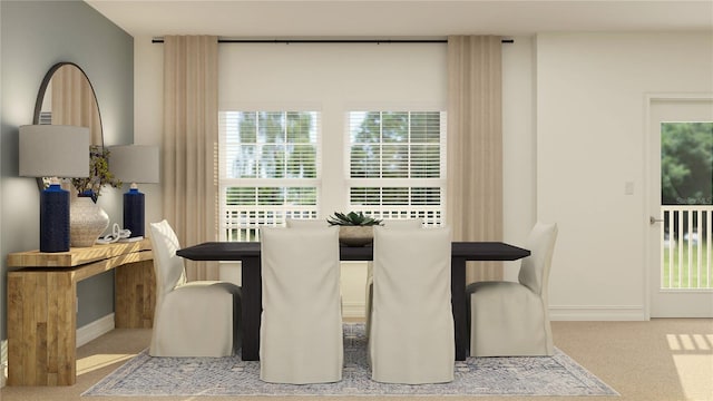 carpeted dining space with baseboards