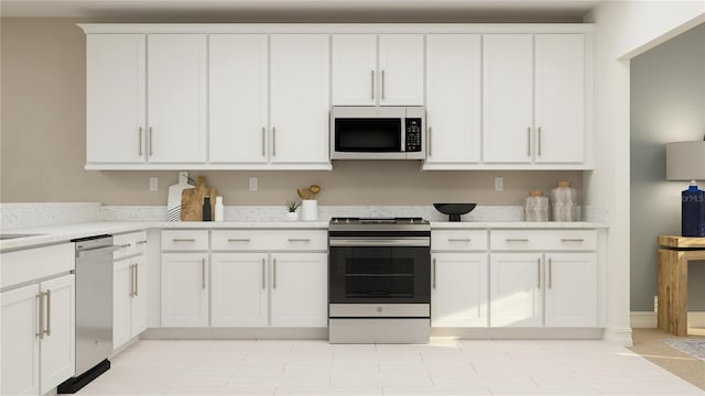 kitchen featuring appliances with stainless steel finishes, white cabinets, and light countertops