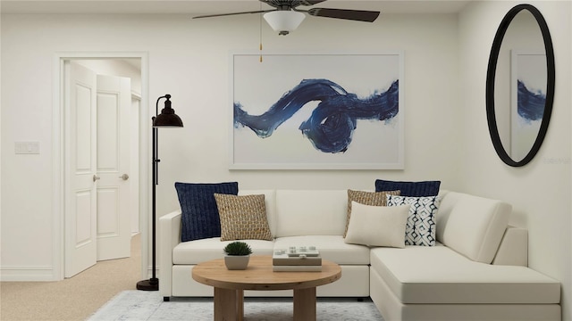 living room featuring ceiling fan, baseboards, and light colored carpet