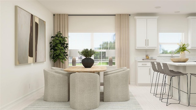 dining room featuring baseboards