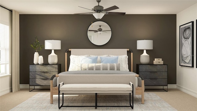 bedroom featuring baseboards, ceiling fan, and light colored carpet