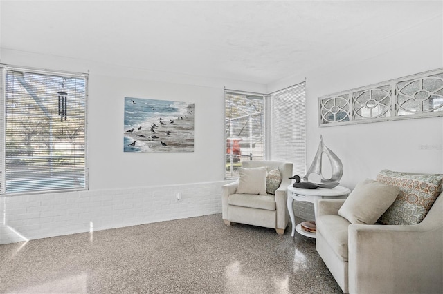 living area with speckled floor