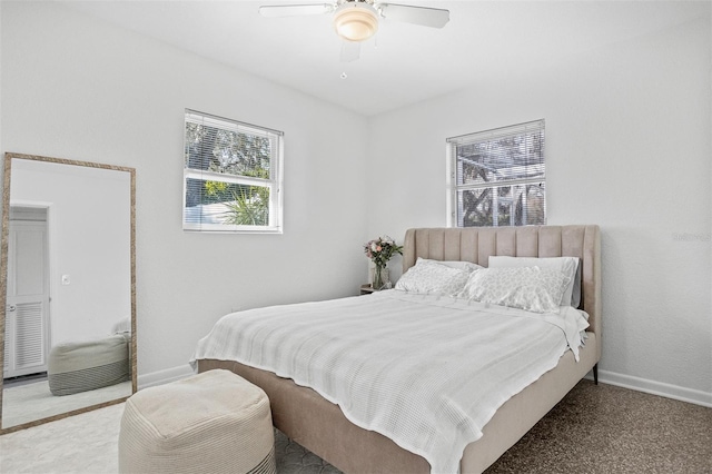 bedroom with baseboards and a ceiling fan