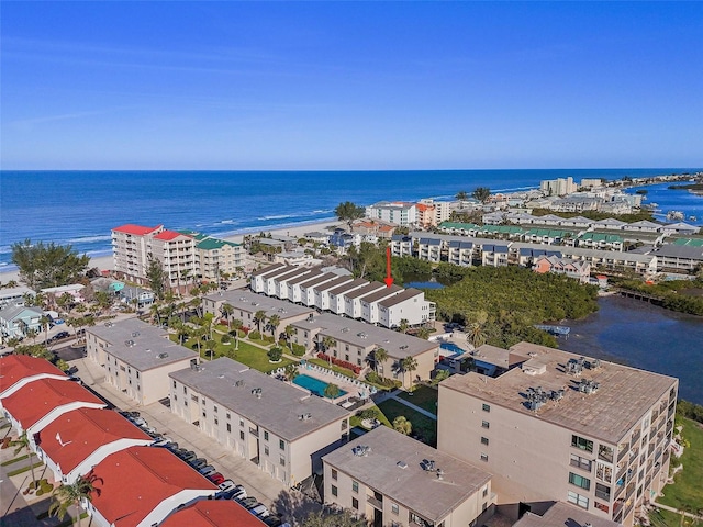 birds eye view of property with a view of city and a water view