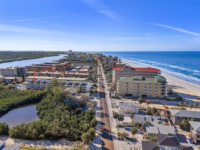 bird's eye view with a beach view and a water view