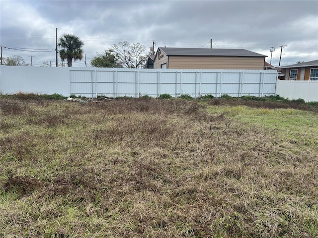 view of yard with fence