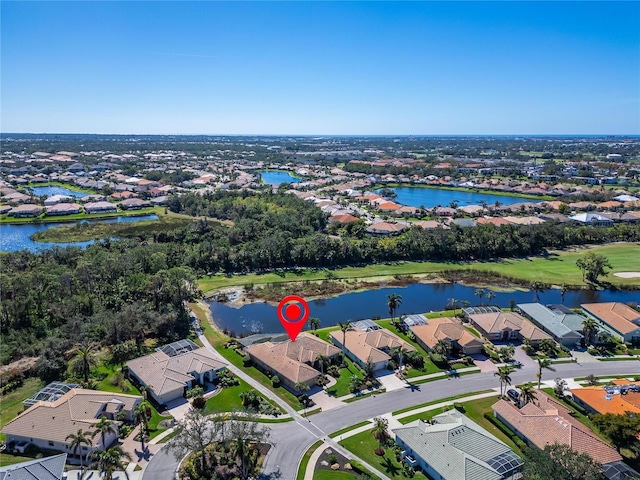 bird's eye view with a water view and a residential view