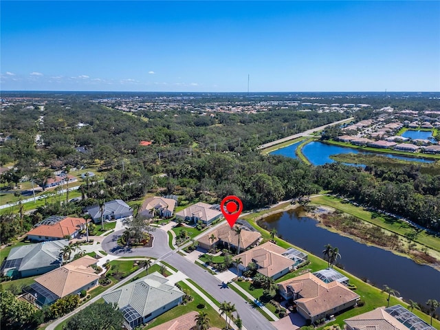 birds eye view of property featuring a residential view and a water view