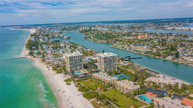 birds eye view of property featuring a view of city, a beach view, and a water view