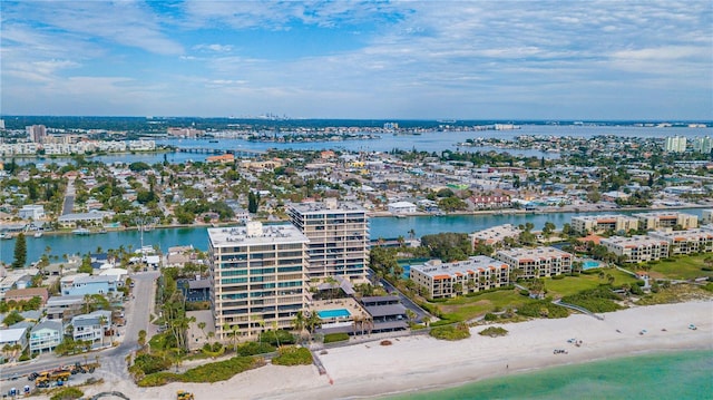 drone / aerial view with a view of city, a water view, and a view of the beach