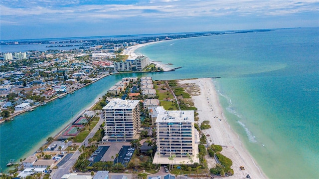 bird's eye view featuring a city view, a water view, and a beach view