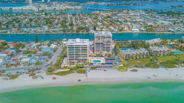 birds eye view of property with a view of city, a water view, and a beach view