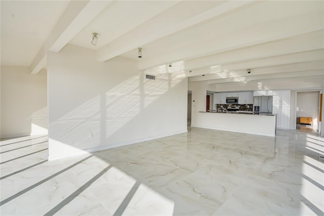 living room with marble finish floor, visible vents, baseboards, and beam ceiling