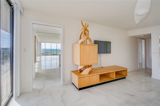 mudroom featuring marble finish floor and baseboards