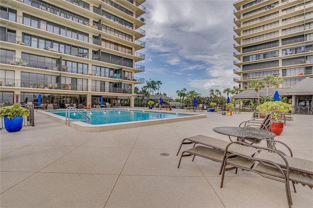 pool featuring a patio area