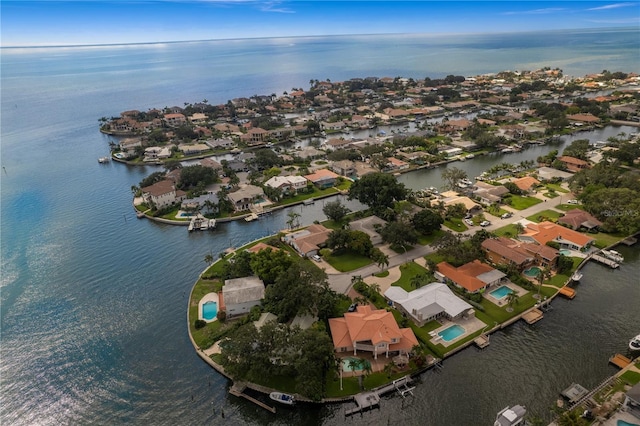 birds eye view of property featuring a water view and a residential view