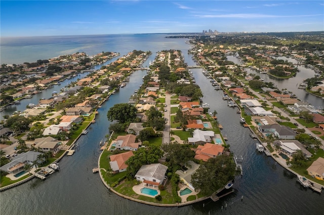 drone / aerial view with a residential view and a water view