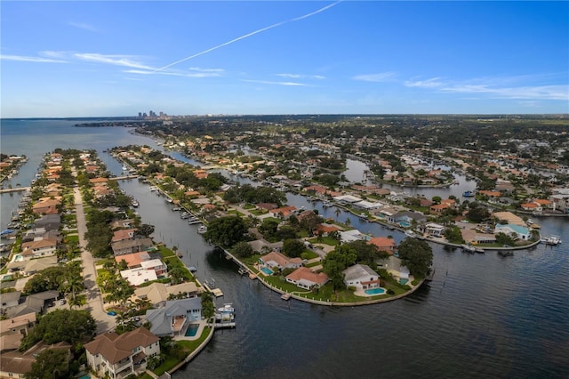 drone / aerial view with a water view and a residential view