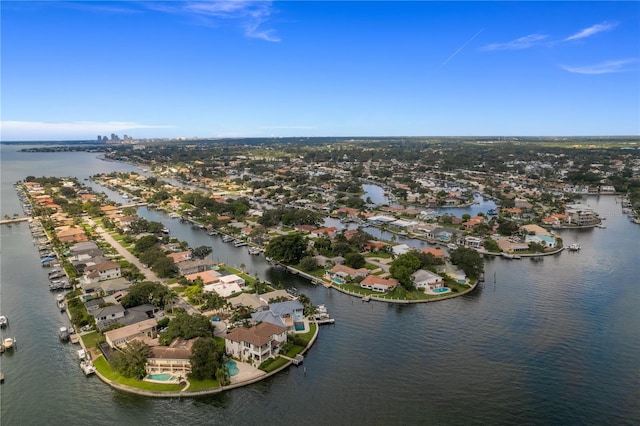 drone / aerial view with a water view and a residential view