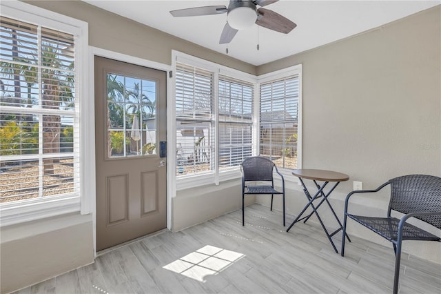 interior space with ceiling fan and light wood-style floors