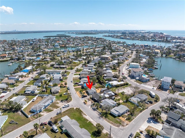 bird's eye view with a residential view and a water view