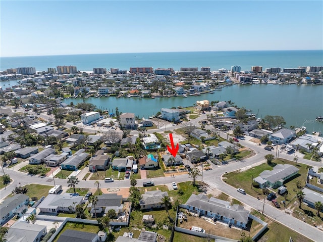 drone / aerial view featuring a residential view and a water view