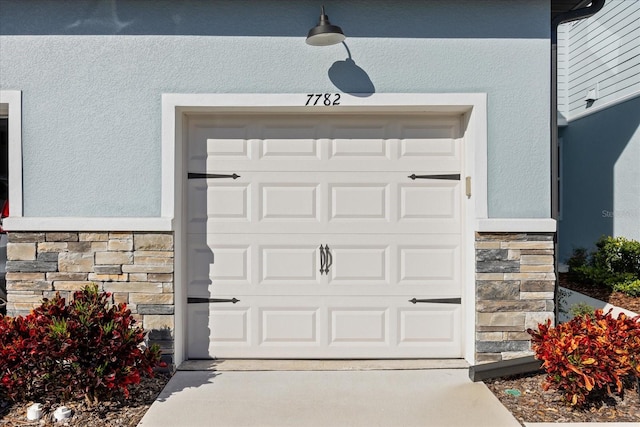 garage with concrete driveway