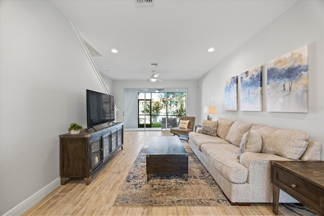 living area featuring ceiling fan, recessed lighting, light wood-type flooring, and baseboards