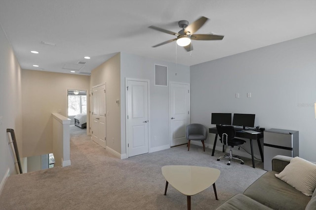 office space with recessed lighting, visible vents, baseboards, and light colored carpet