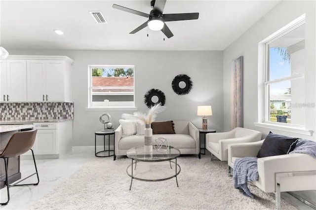 living room featuring marble finish floor, recessed lighting, visible vents, a ceiling fan, and baseboards