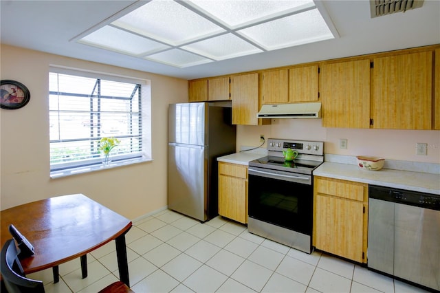 kitchen featuring range hood, stainless steel appliances, light countertops, visible vents, and light tile patterned flooring