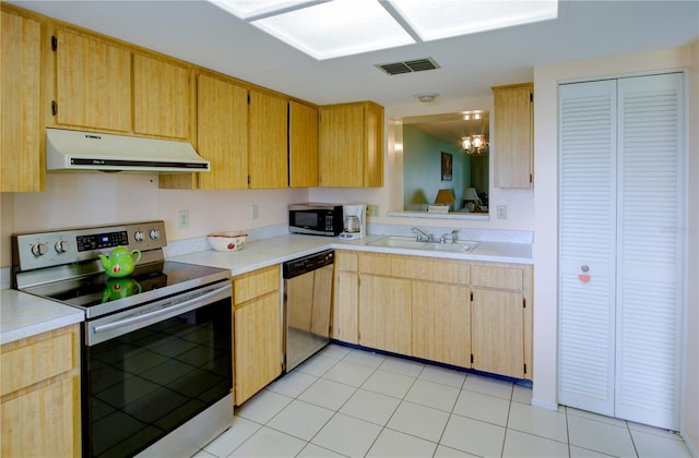 kitchen featuring stainless steel appliances, a sink, visible vents, light countertops, and ventilation hood